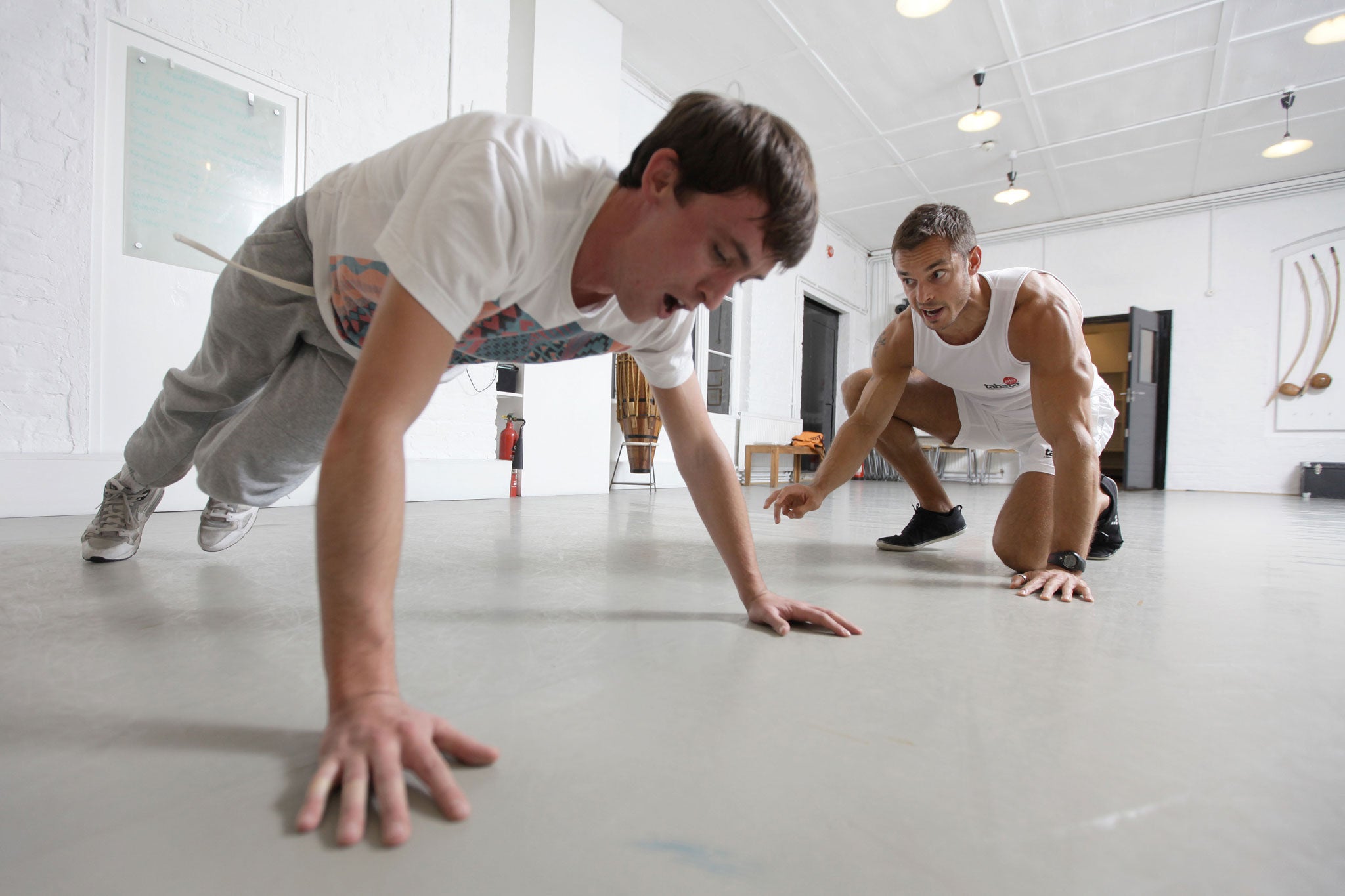 Oscar Quine is put through his paces by fitness instructor Richard Scrivener