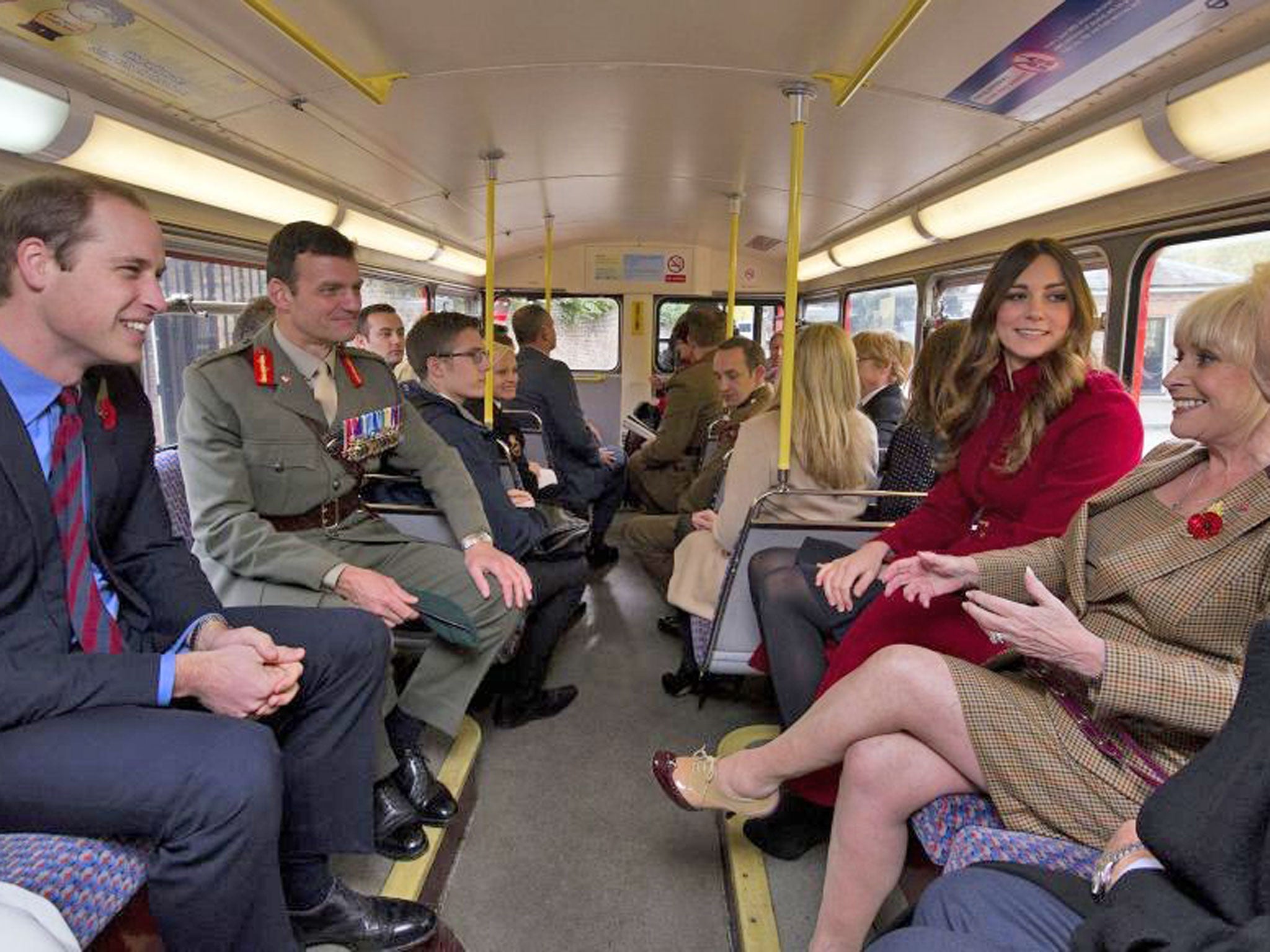 The Duke and Duchess of Cambridge and Barbara Windsor surprised hundreds of commuters as they travelled on a 1960s Routemaster bus to High Street Kensington station where they met military personnel and volunteers supporting London Poppy Day
