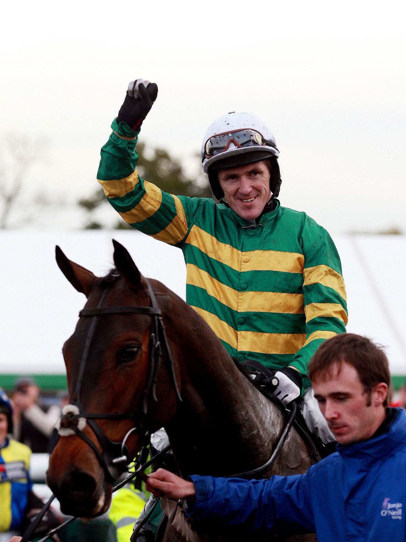 Jump jockey Tony McCoy celebrates his 4,000th winner