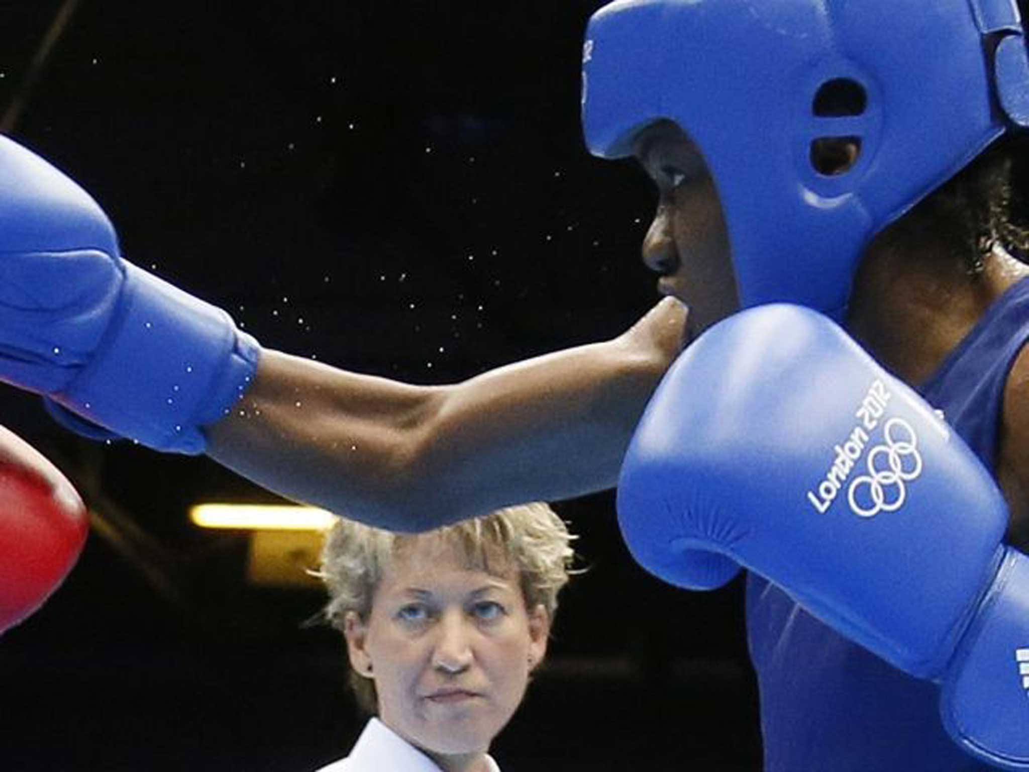 Team GB’s Nicola Adams on her way to the flyweight gold medal against Cancan Ren of China during London 2012