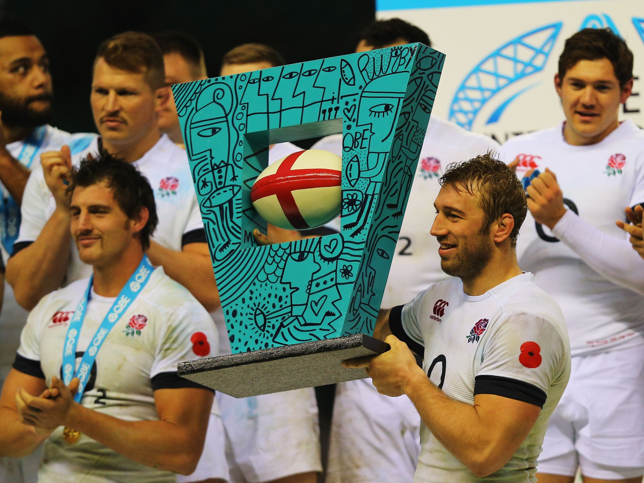 Chris Robshaw the England captain lifts the trophy following his sides victory during the QBE International match between England and Argentina at Twickenham Stadium
