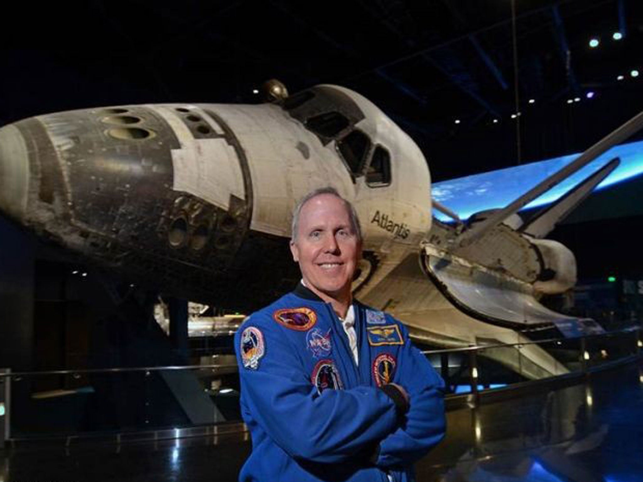 Walk this way: astronaut Tom Jones in front of a space shuttle. He was on four space shuttle missions and completed three space walks