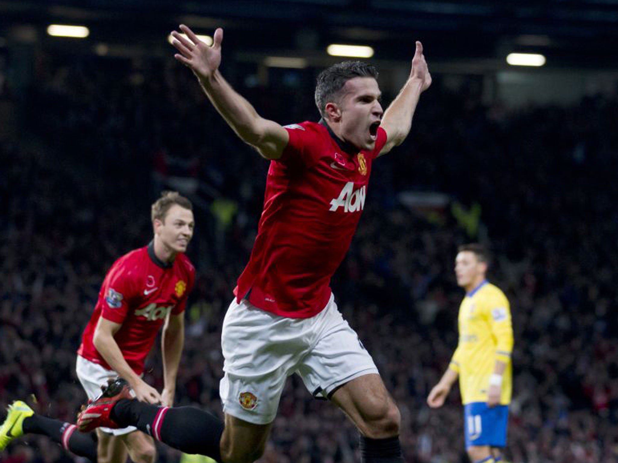 Robin van Persie celebrates his winning goal against Arsenal