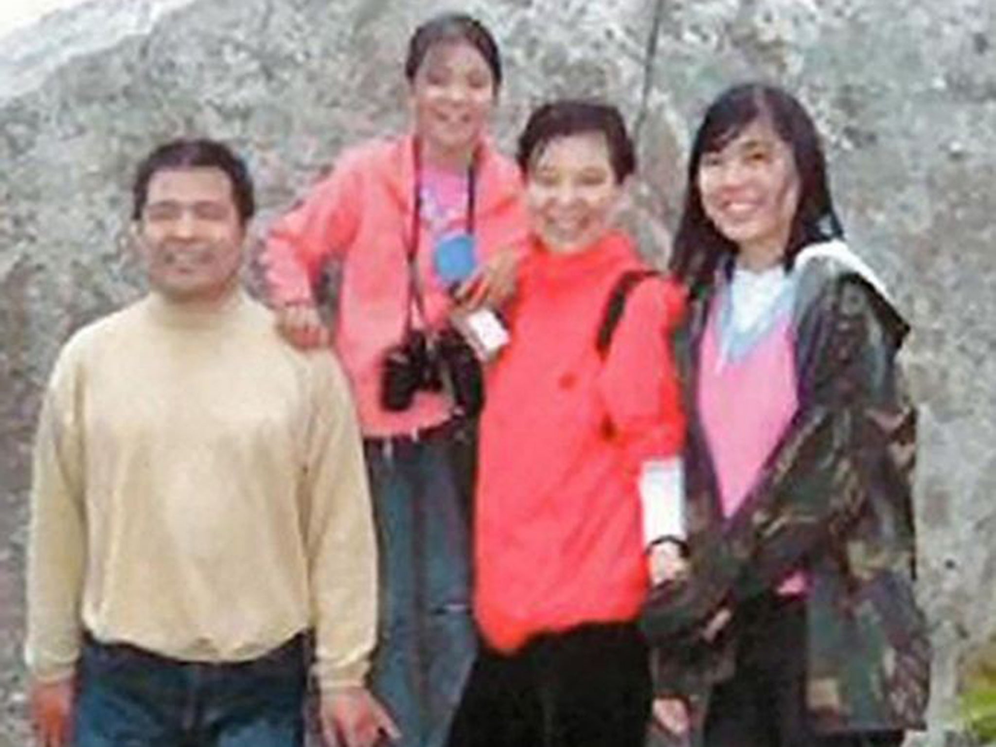 Jifeng Ding with his wife Helen and daughters Xing and Alice