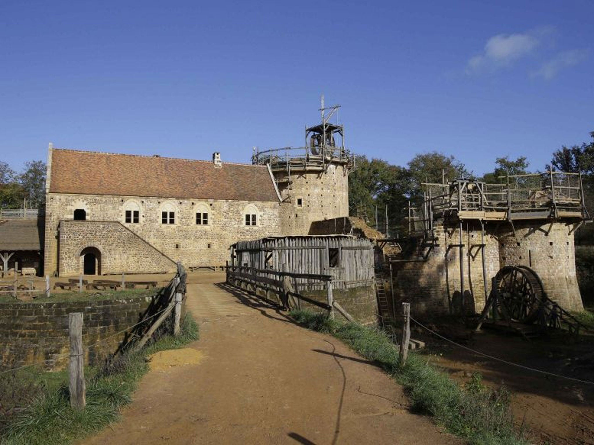 The construction site of the Chateau de Guedelon which started out as an eccentric project is now an established enterprise, employing 65 people and drawing in visitors from around Europe every year