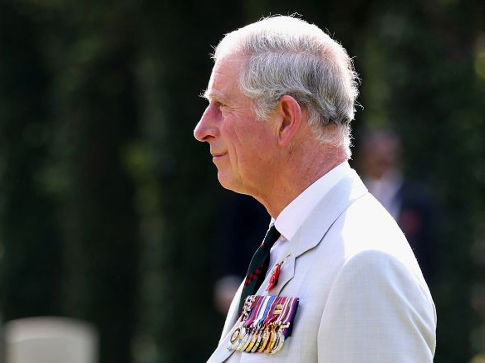 Prince Charles lays a wreath at Kirkee Commonwealth Cemetary on his official visit to India on 10 November 2013