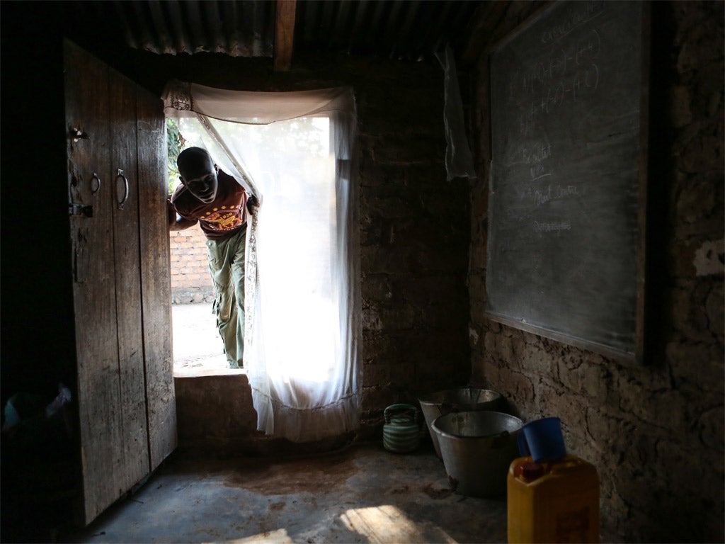 15-year-old who was formerly a child soldier at his house in Bangui; many of the children affected were given drugs to make them more combative, and have to be weaned off them