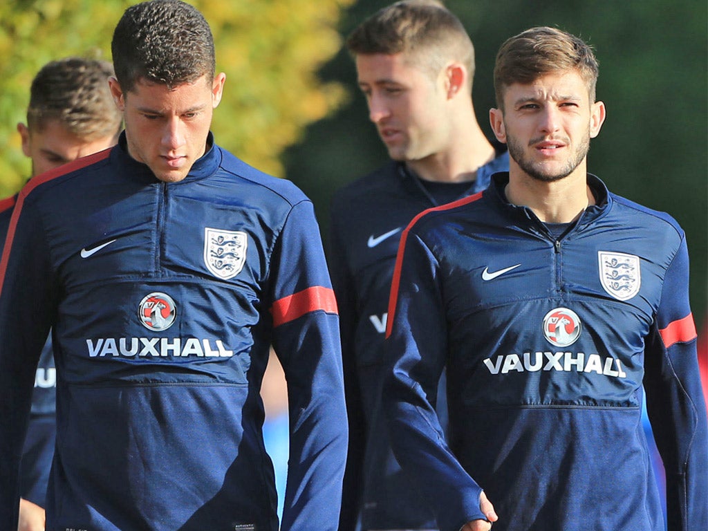 Ross Barkley (left) walks with Adam Lallana during training at London Colney