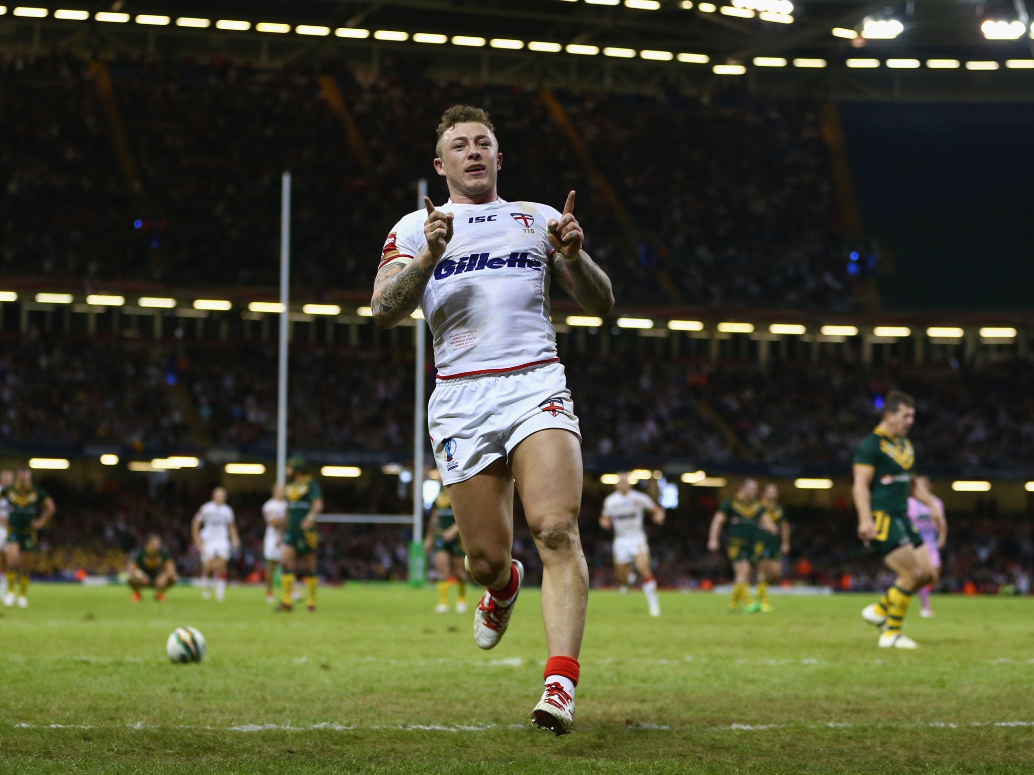 England winger Josh Charnley celebrates after scoring against Australia