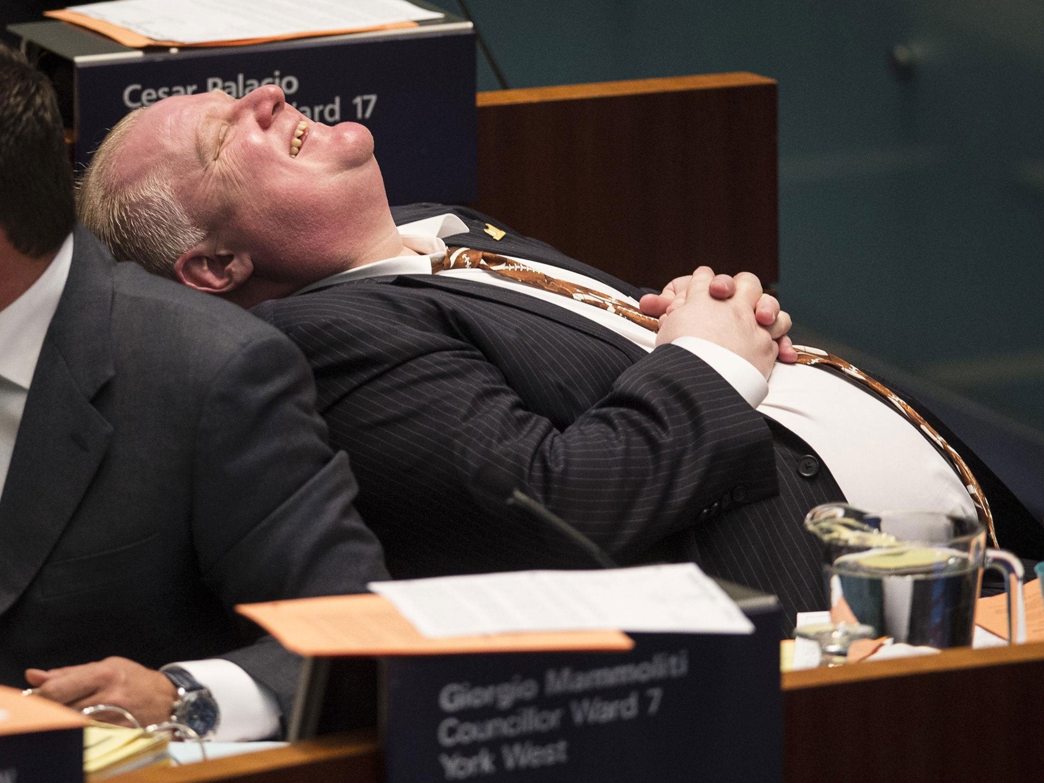 Rob Ford laughs during council at City Hall in Toronto