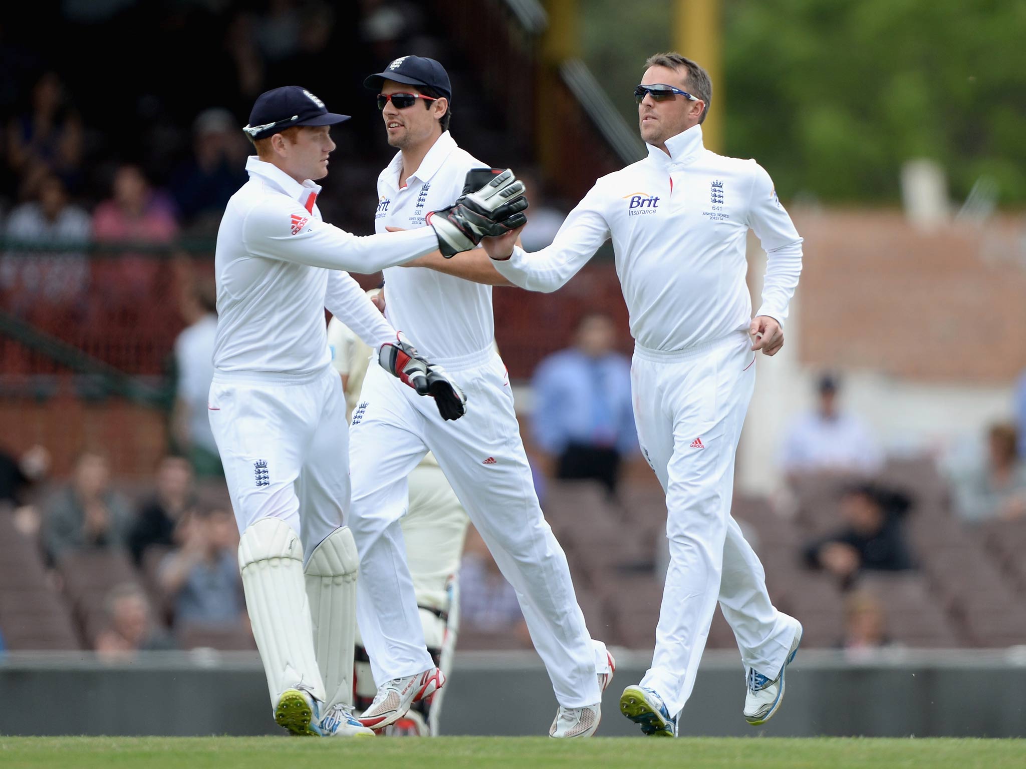 Graeme Swann celebrates with Jonathan Bairstow after dismissing Aaron Finch of CA Invitational XI during day three of the tour match