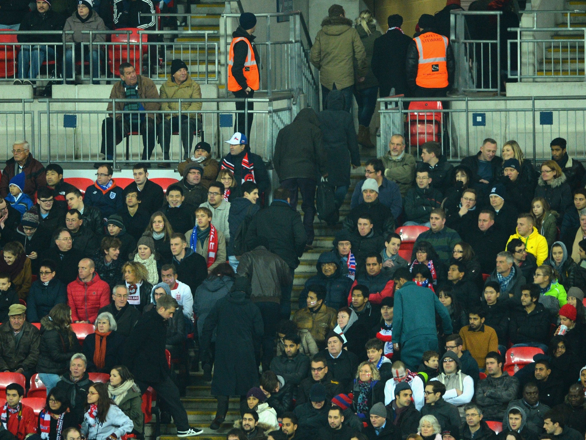 England fans leave the stadium with 10 minutes of the match left to play