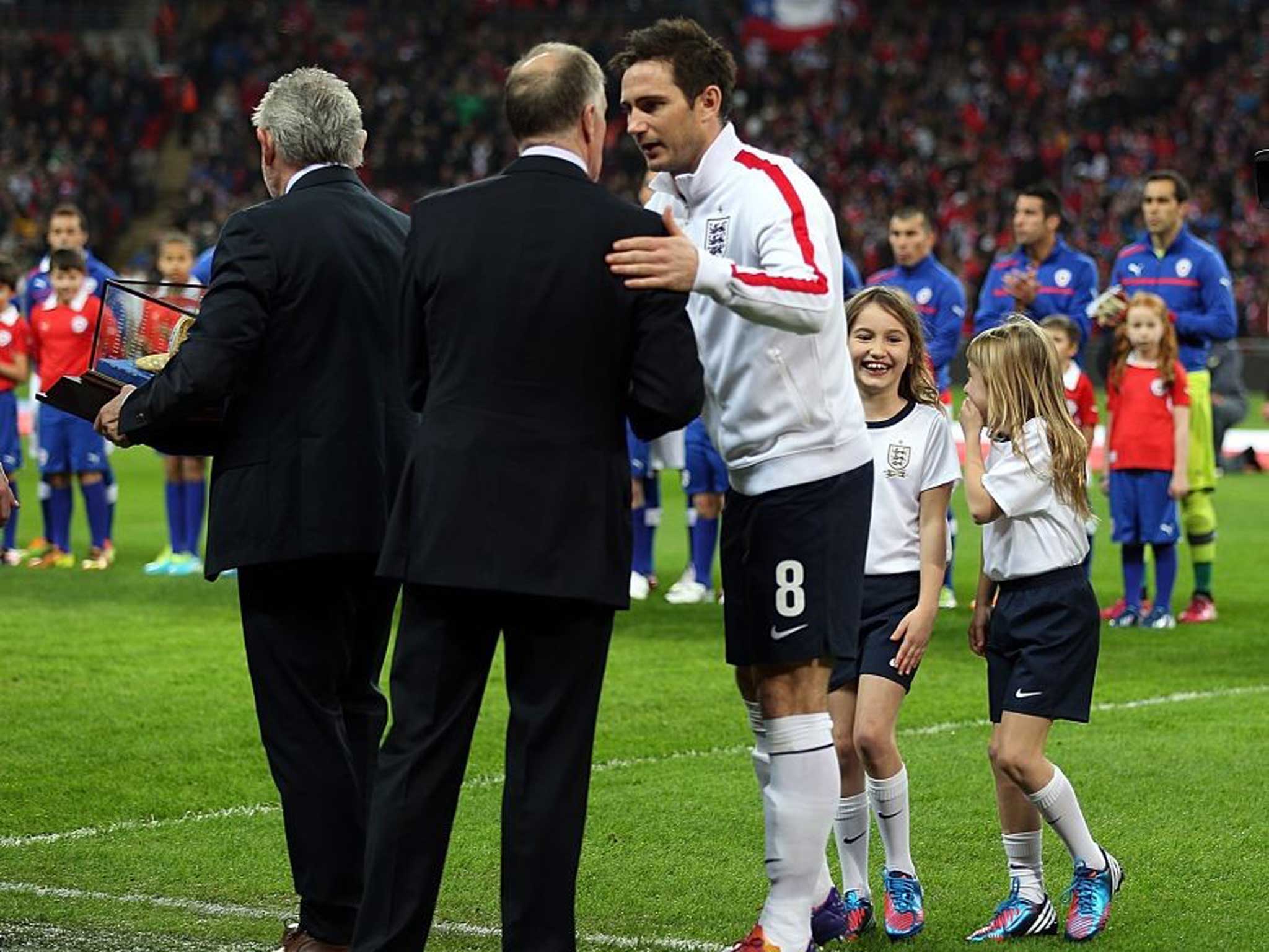 Another hat trick: Sir Geoff Hurst presents Frank Lampard with a golden cap for making 100 England appearances