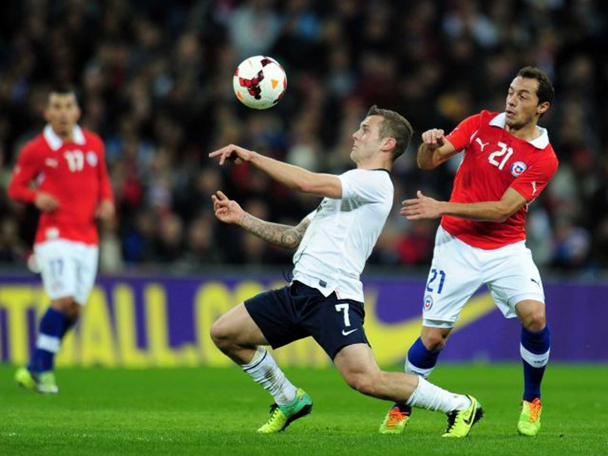 The eyes have it: Jack Wilshere, England’s key midfielder, shields the ball from Chile’s Marcelo Diaz at Wembley on Friday