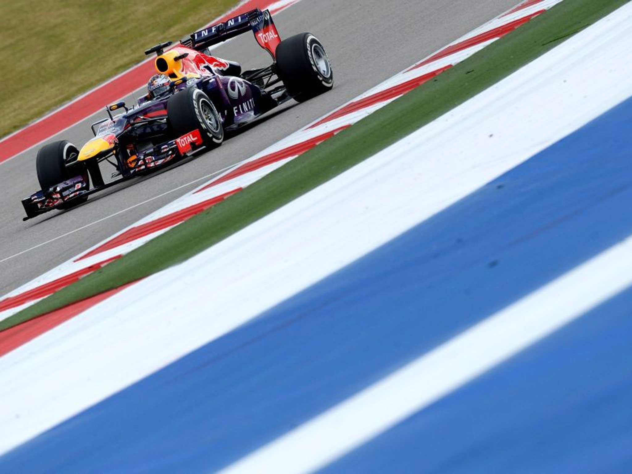 Red Bull's driver Sebastian Vettel of Germany races during the qualifying round for the United States Formula One Grand Prix