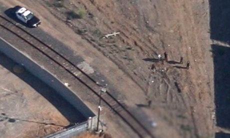 A blurred screenshot from Google Maps showing the scene captured by Google's satellite imagery.