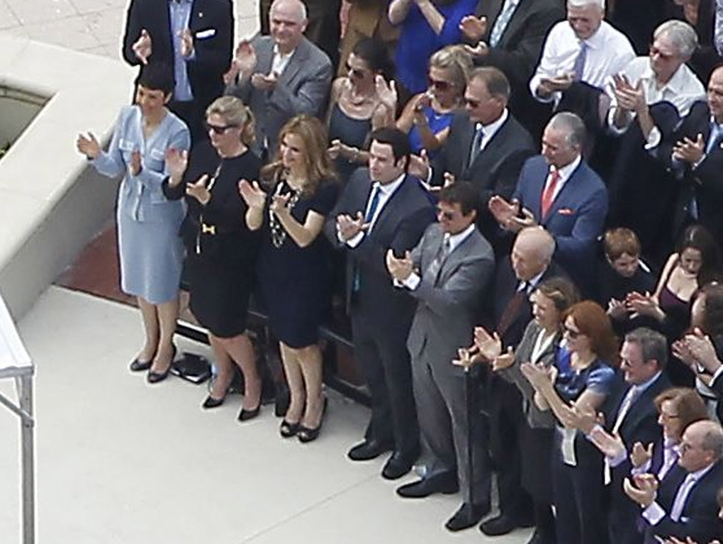 John Travolta and Tom Cruise (front, fourth and fifth from left) applaud David Miscavige