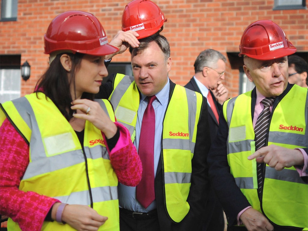 The shadow Chancellor Ed Balls, centre, will promise to underwrite the building of several new towns