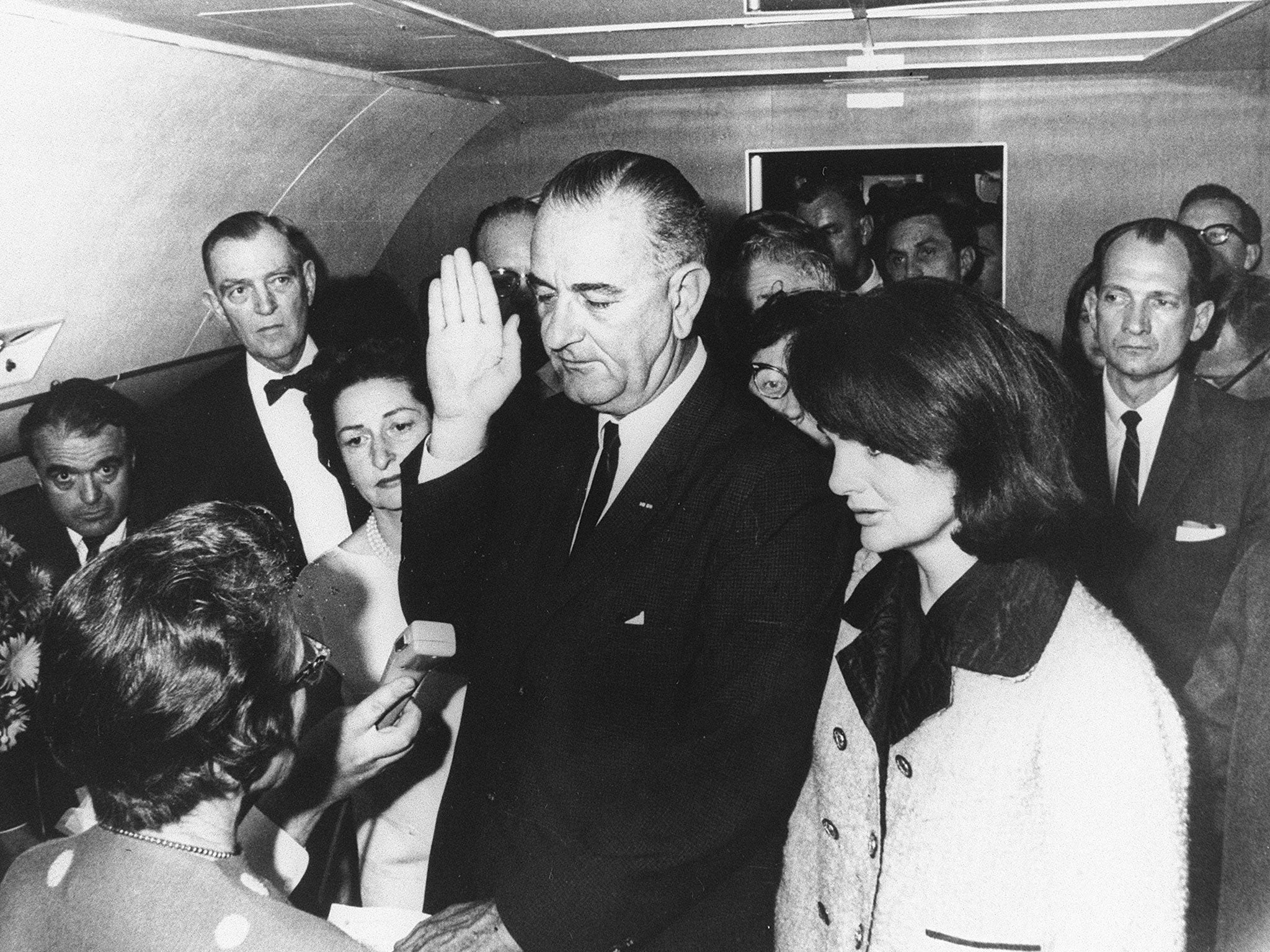 Lyndon B Johnson is sworn in as President on Air Force One, 22 November, 1963 (Getty)