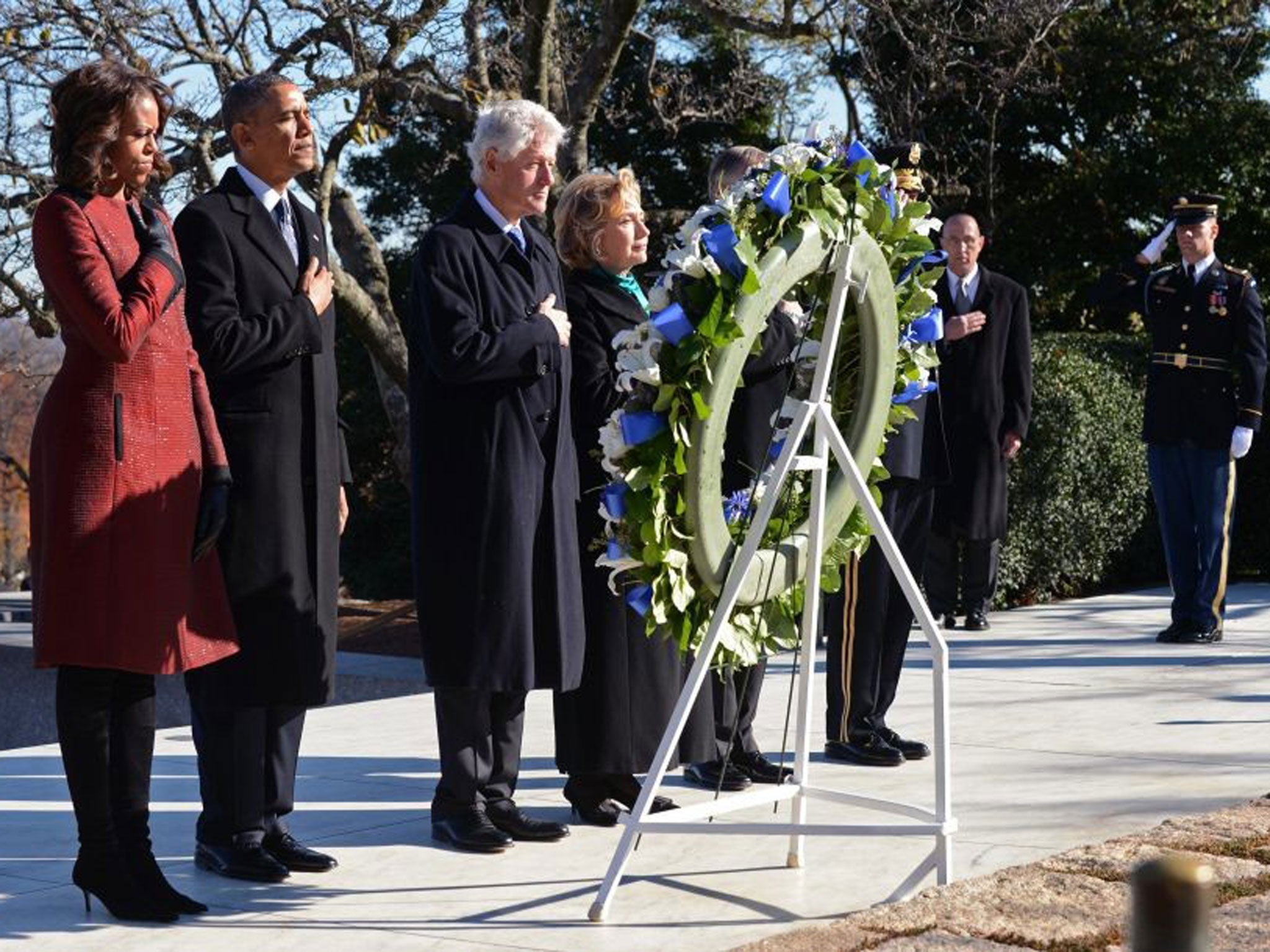 US President Barack Obama, First Lady Michelle Obama , Former US President Bill Clinton and Former Secretary of State Hillary Clinton lay a wreath at the gravesite for President John F. Kennedy at Arlington National Cemetery in Arlington, USA