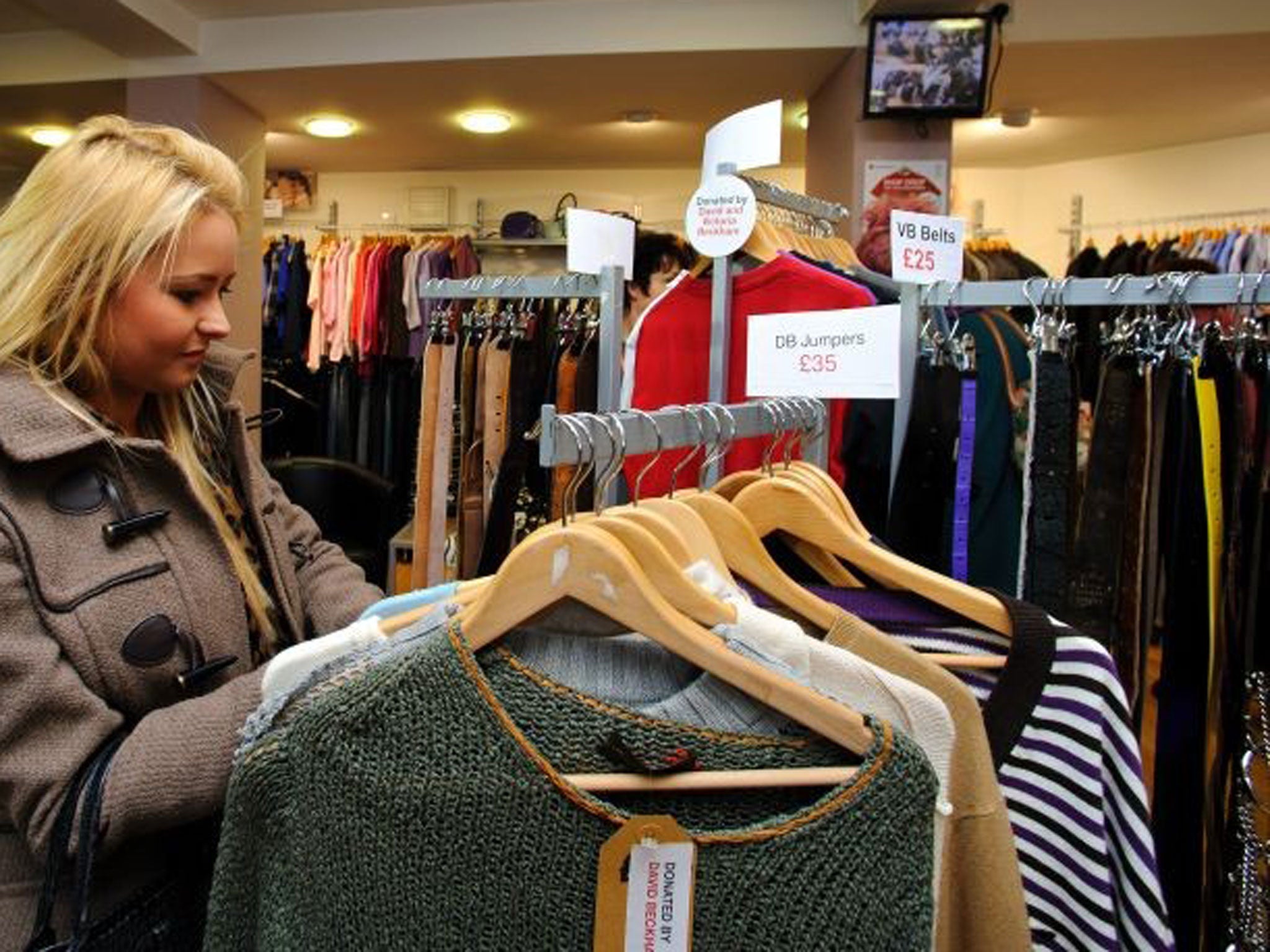 A shopper browses through clothes donated by David Beckham