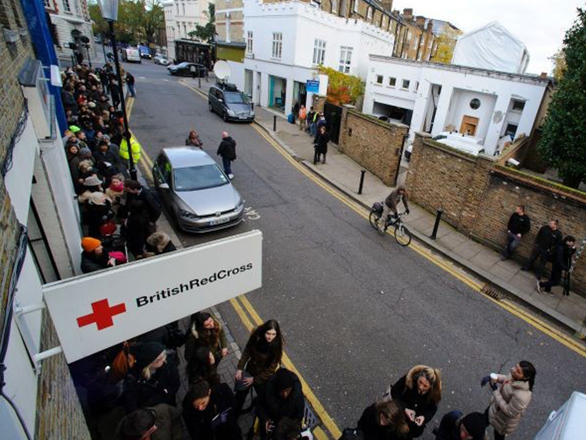 A general view of shoppers queueing to purchase items of David and Victoria Beckham's clothes that were donated to The British Red Cross on 22 November, 2013 in London, England.