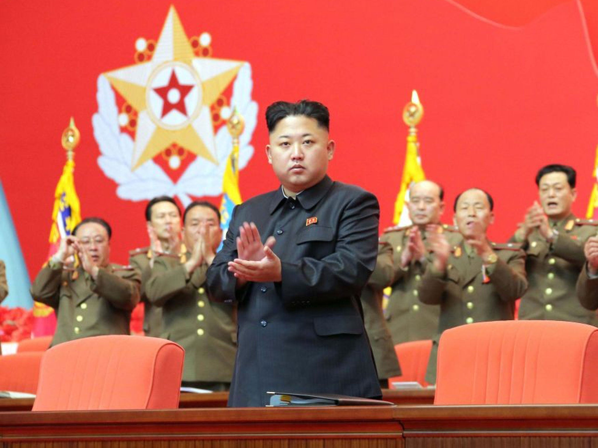 North Korean leader Kim Jong Un applauds during the second meeting of security personnel of the Korean People's Army