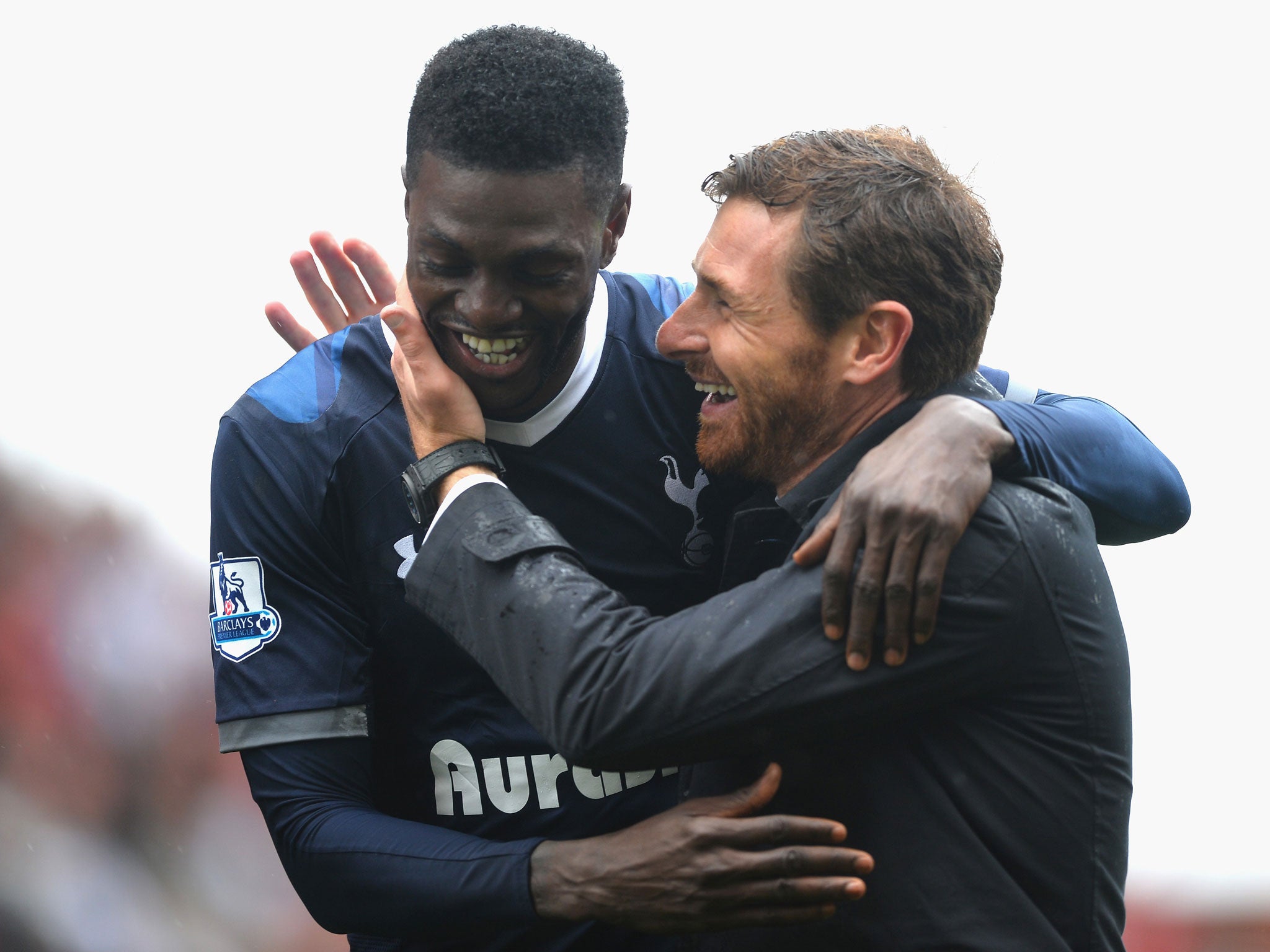 Emmanuel Adebayor shares a happy moment with Tottenham manager Andre Villas-Boas