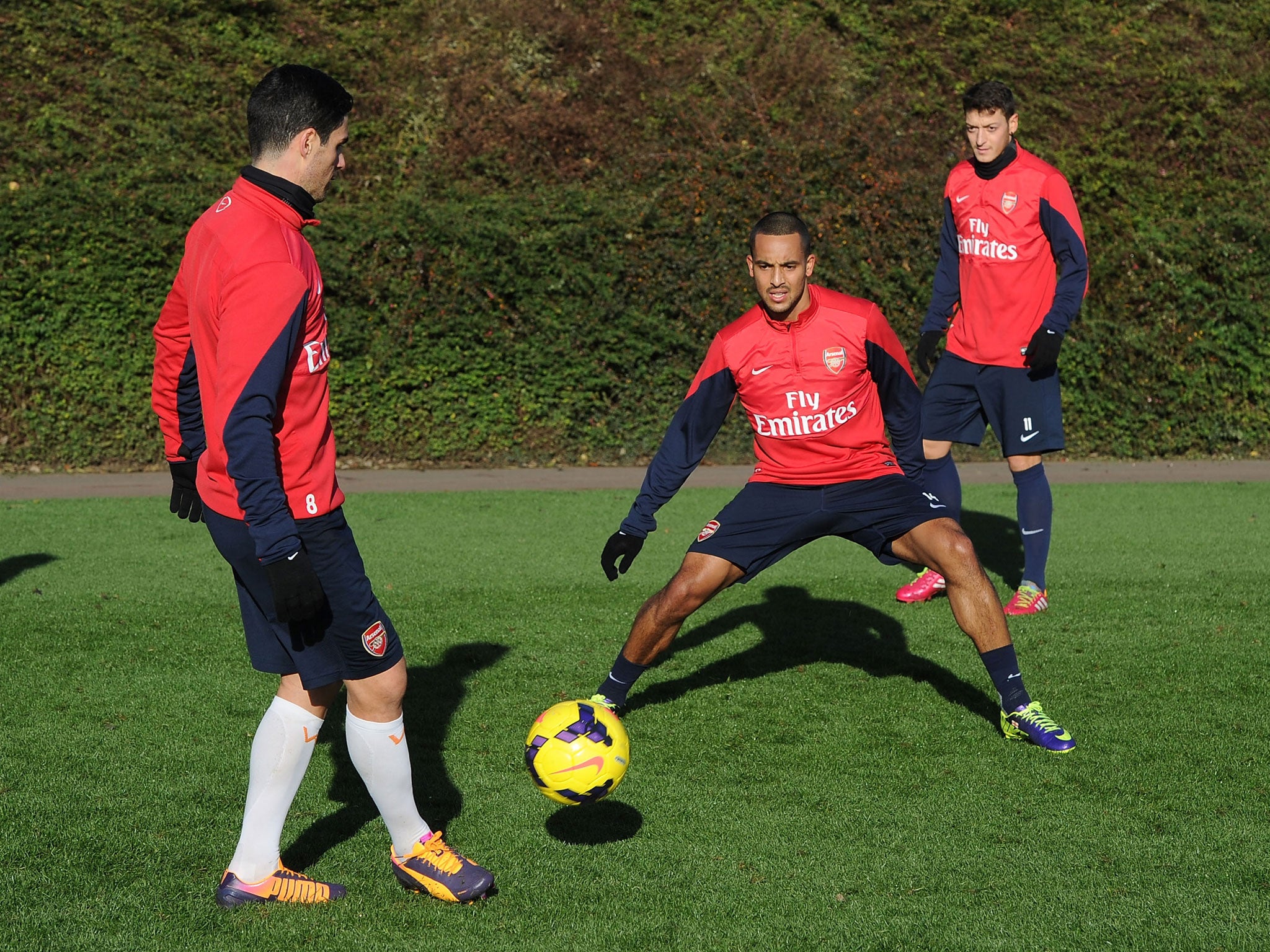 Mikel Arteta, Theo Walcott and Mesut Ozil at training