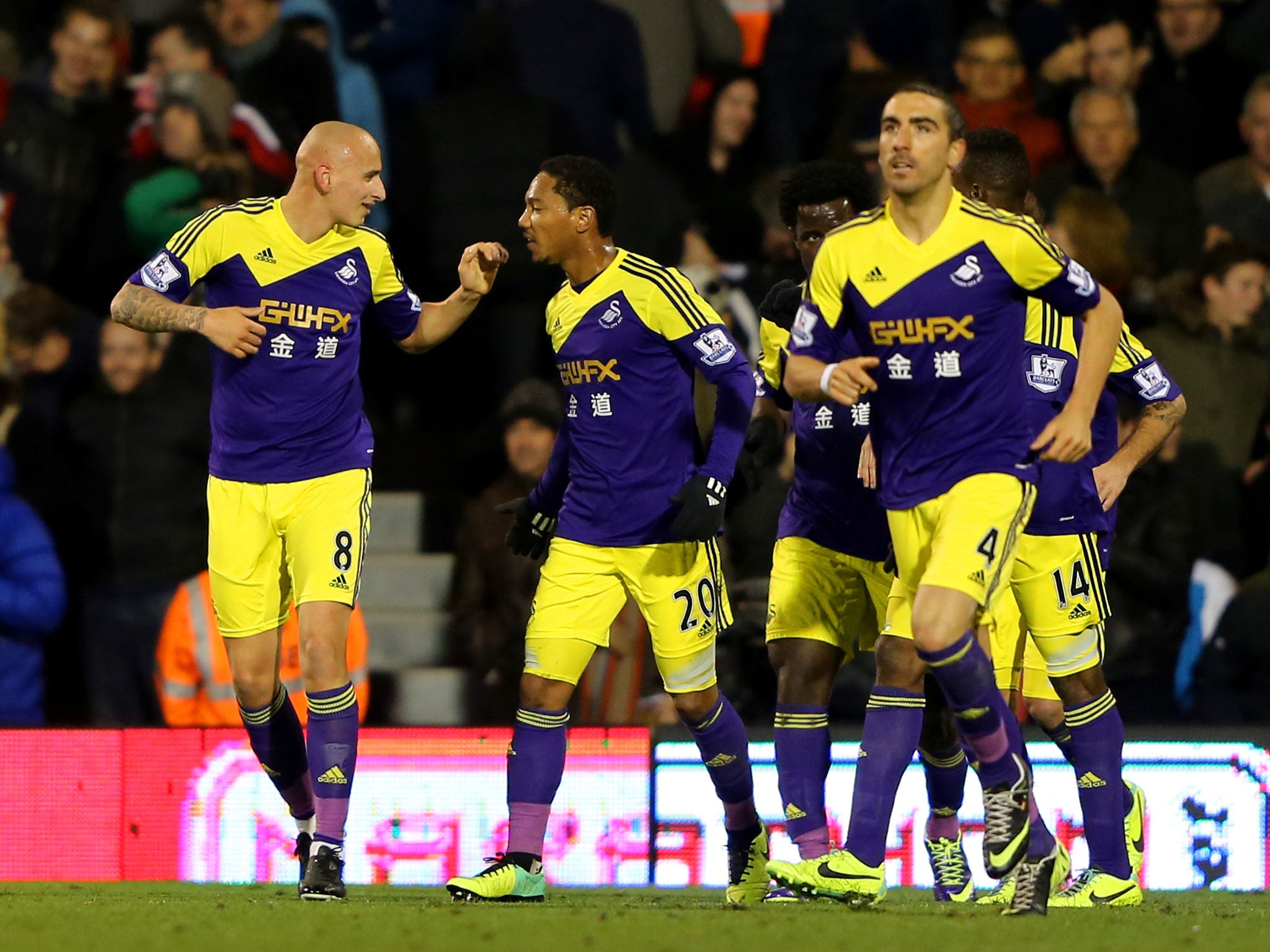 Fulham 1 Swansea City 2: Jonjo Shelvey (L) of Swansea celebrates scoring his team's second goal