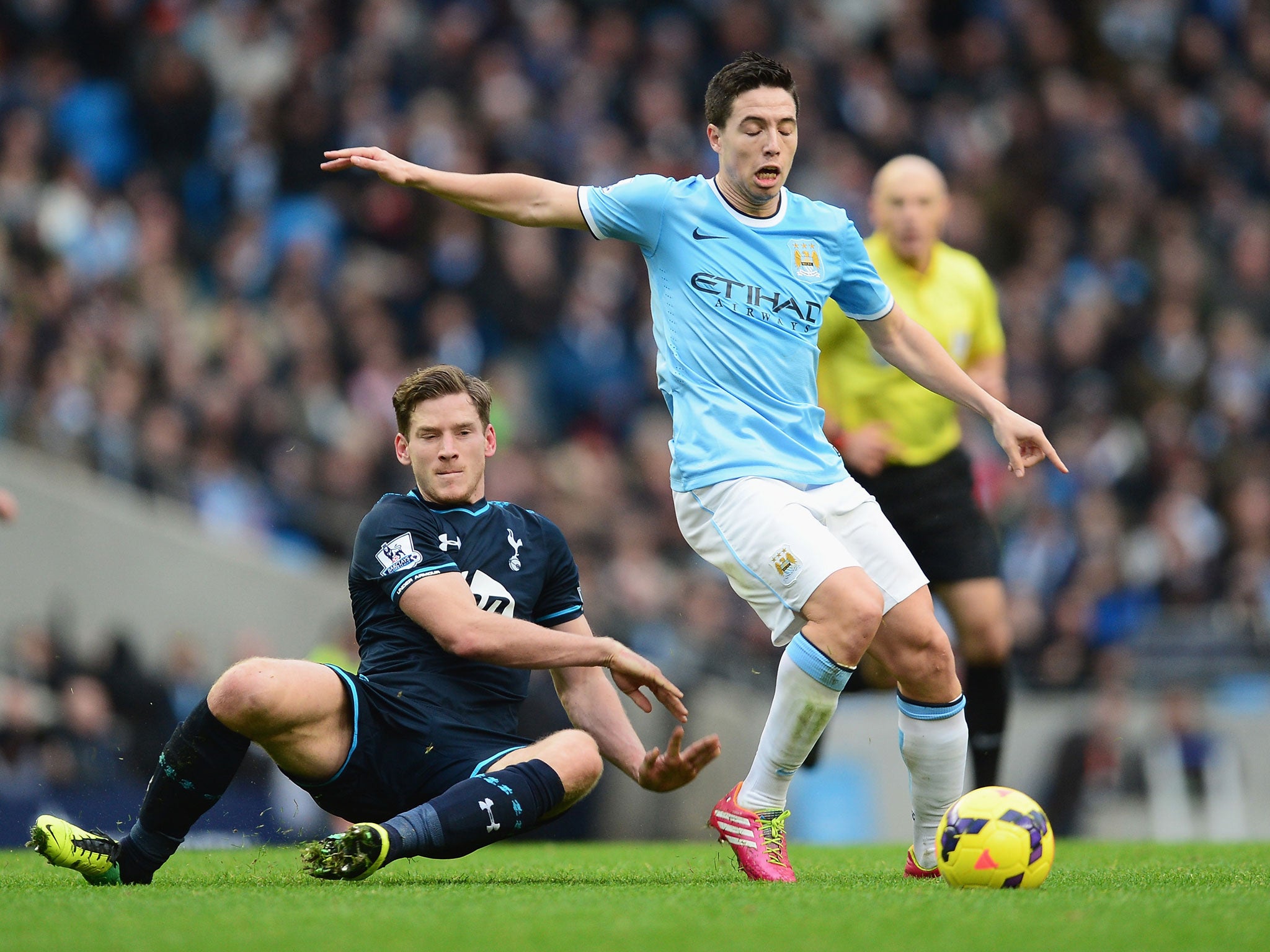 Jan Vertonghen of Tottenham Hotspur challenges Samir Nasri