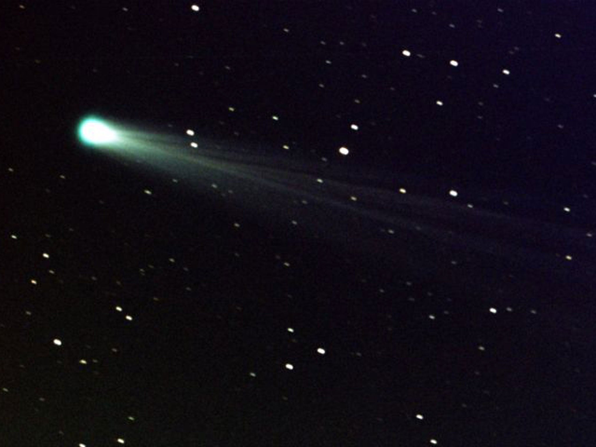 In this photo provided by NASA, Comet ISON shows off its tail. At the time of this image, it was some 44 million miles from the sun - and 80 million miles from Earth - moving at a speed of 136,700 mph