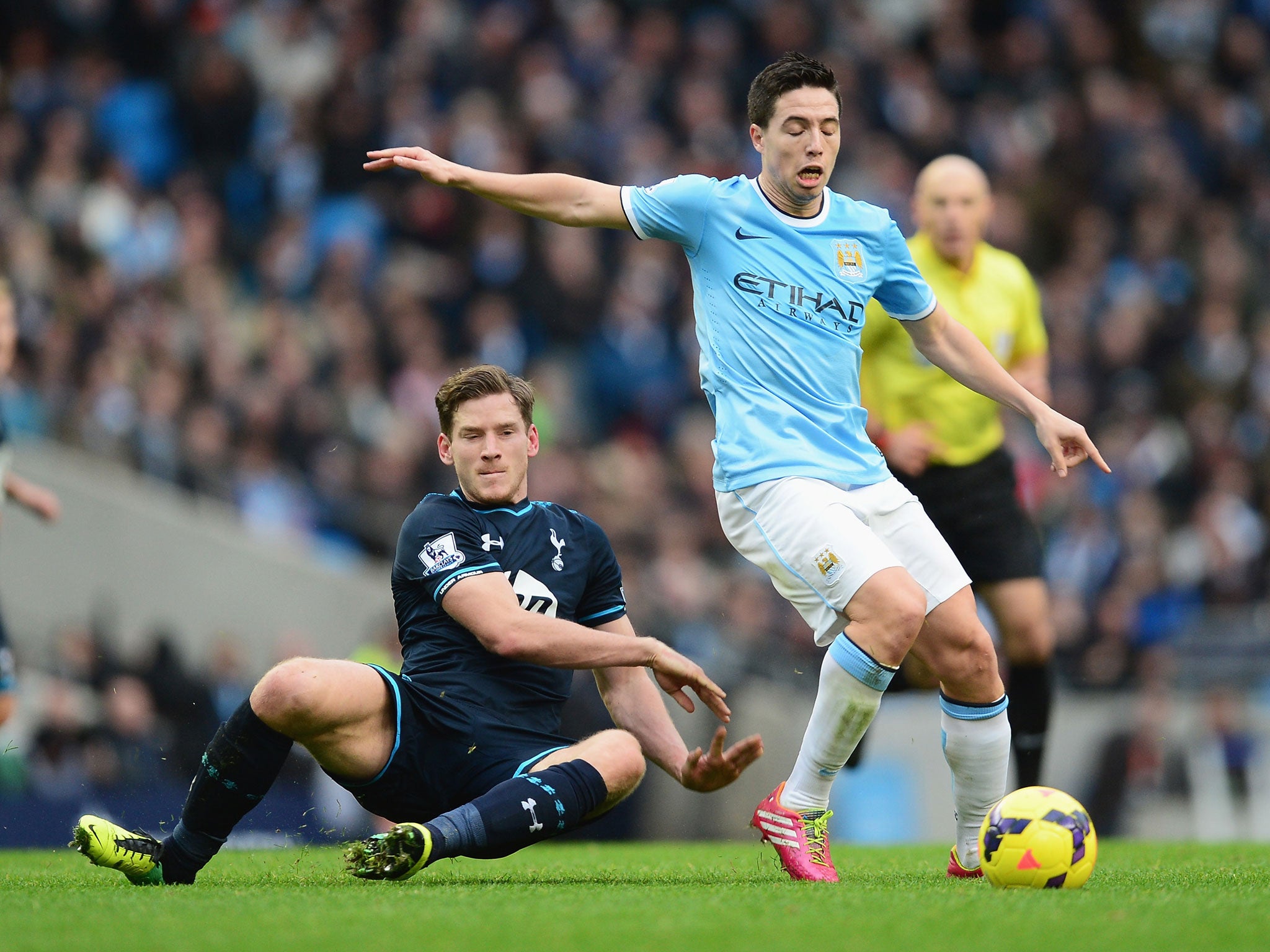 Jan Vertonghen attempts to stop Samir Nasri during Tottenham's 6-0 defeat to Manchester City