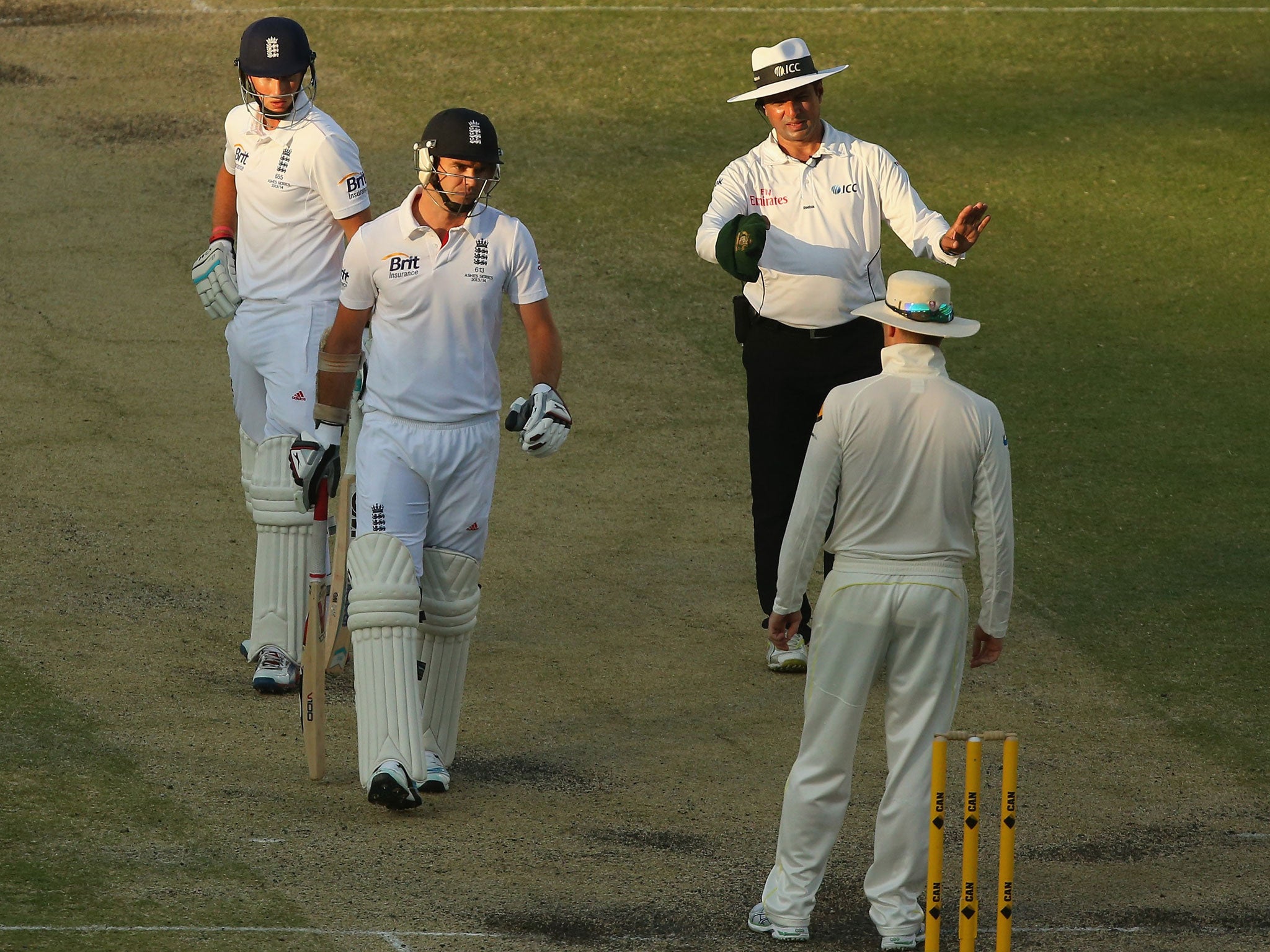 Australian captain Michael Clarke and England's James Anderson exchange words during day four at The Gabba