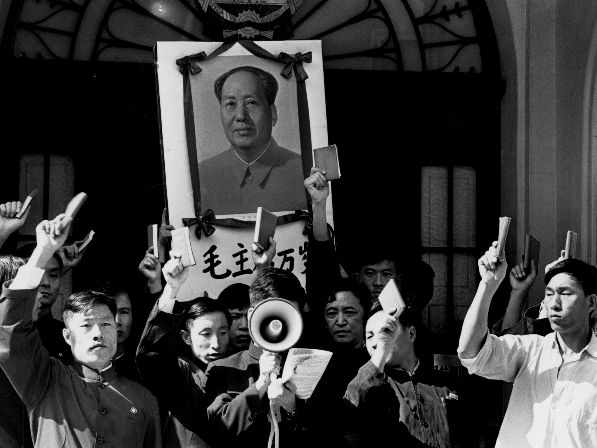 A Maoist delegation outside London's Chinese embassy in 1967 waving copies of the 'Little Red Book'