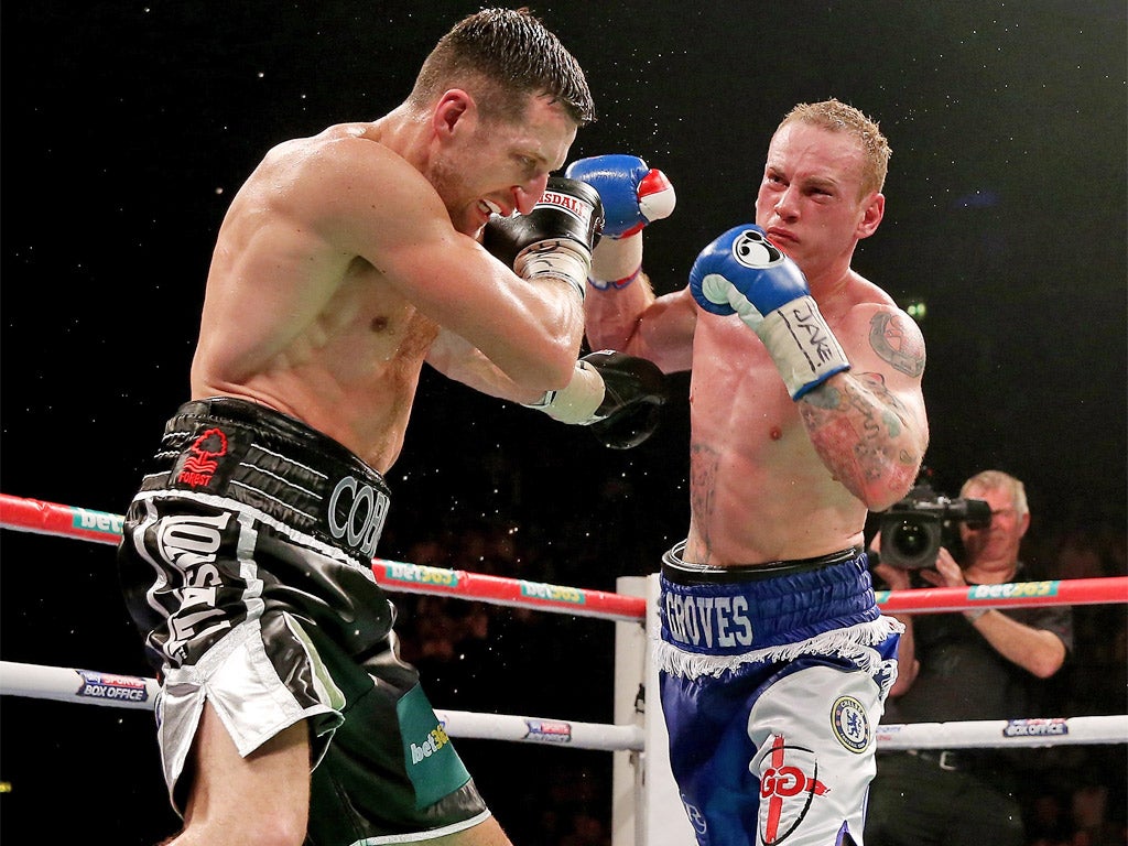 Carl Froch (left) takes a hit during his win over George Groves