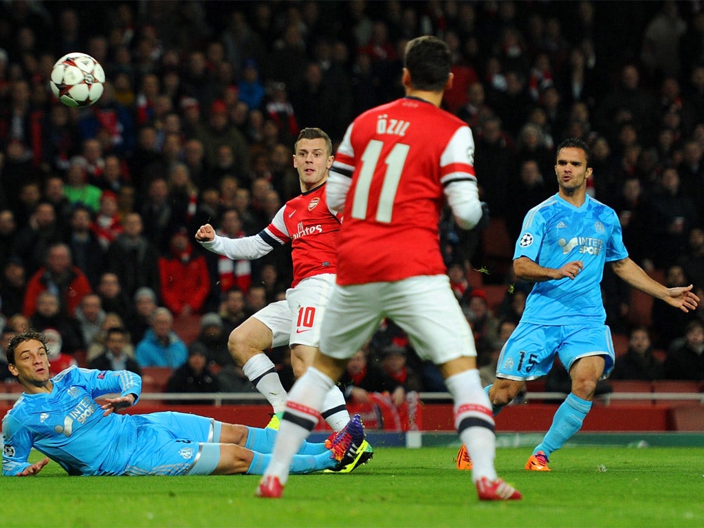 Wilshere curls in Arsenal's opener in the very first minute of the game (Getty)