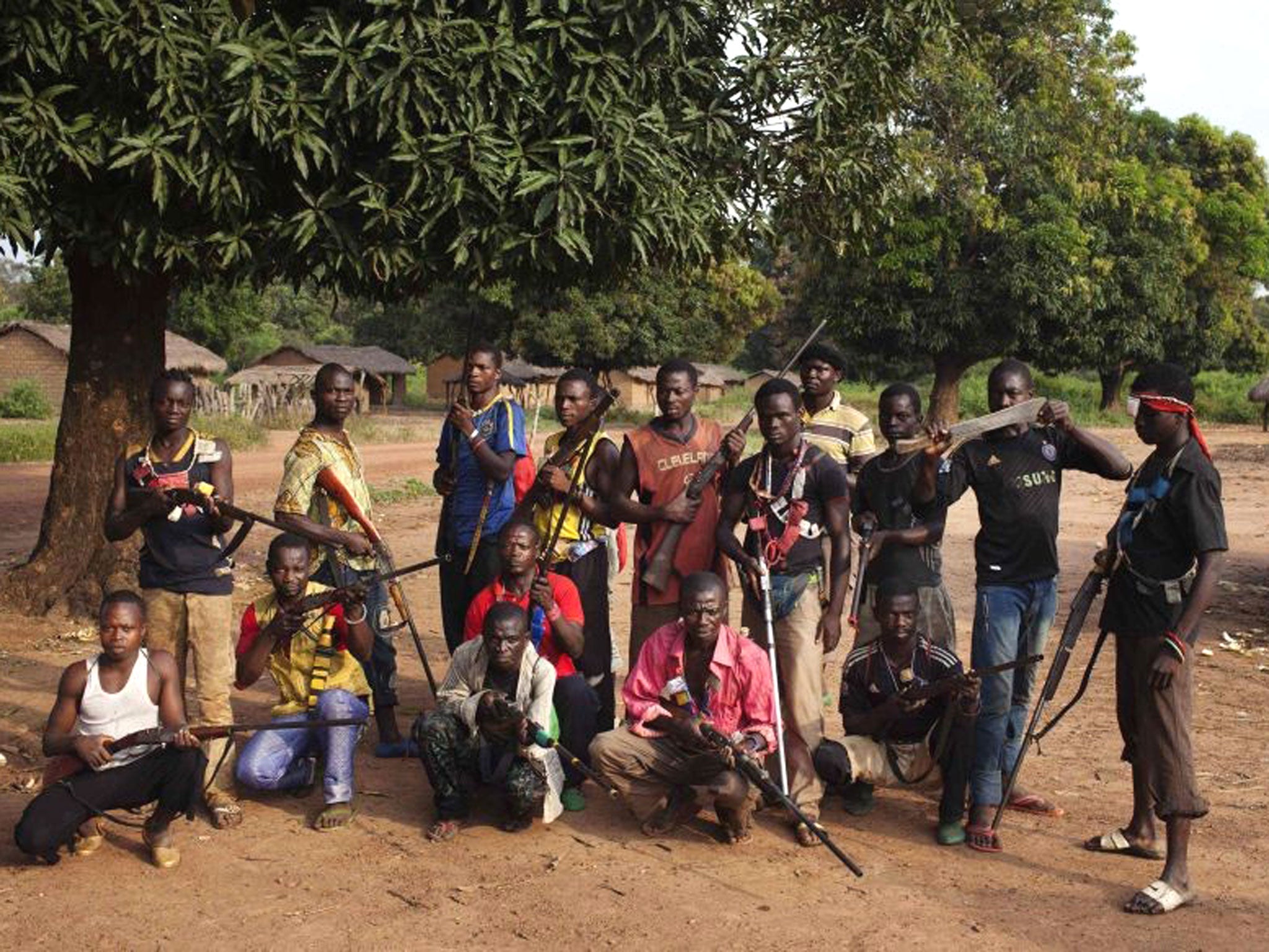 Militia fighters known as anti-balaka pose for a photograph in Mbakate village, Central African Republic