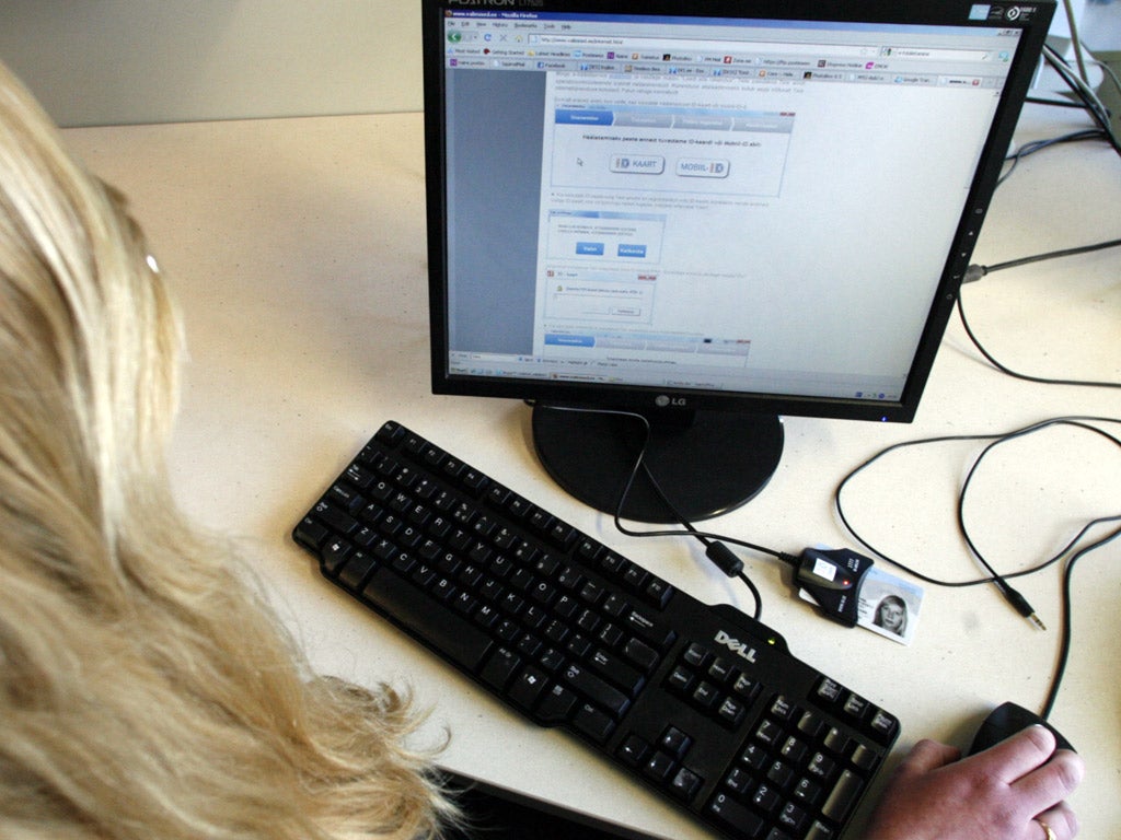 A woman casts her vote in the 2011 Estonian general election (Getty)