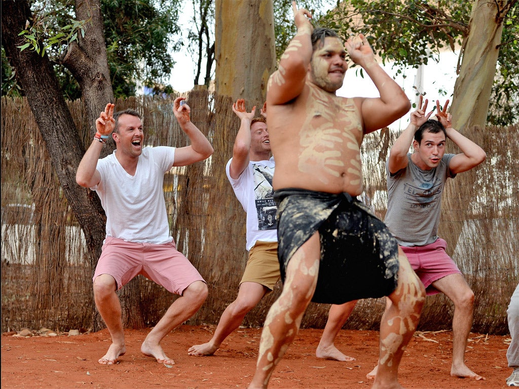 Graeme Swann takes part in an Aboriginal dance during a visit to
Ayers Rock