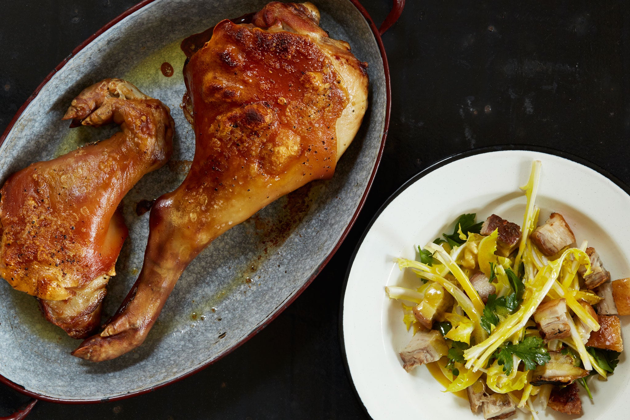 Crispy cheek and dandelion salad with roast pork