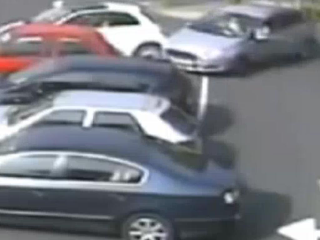 The moment the driver hits two other parked cars