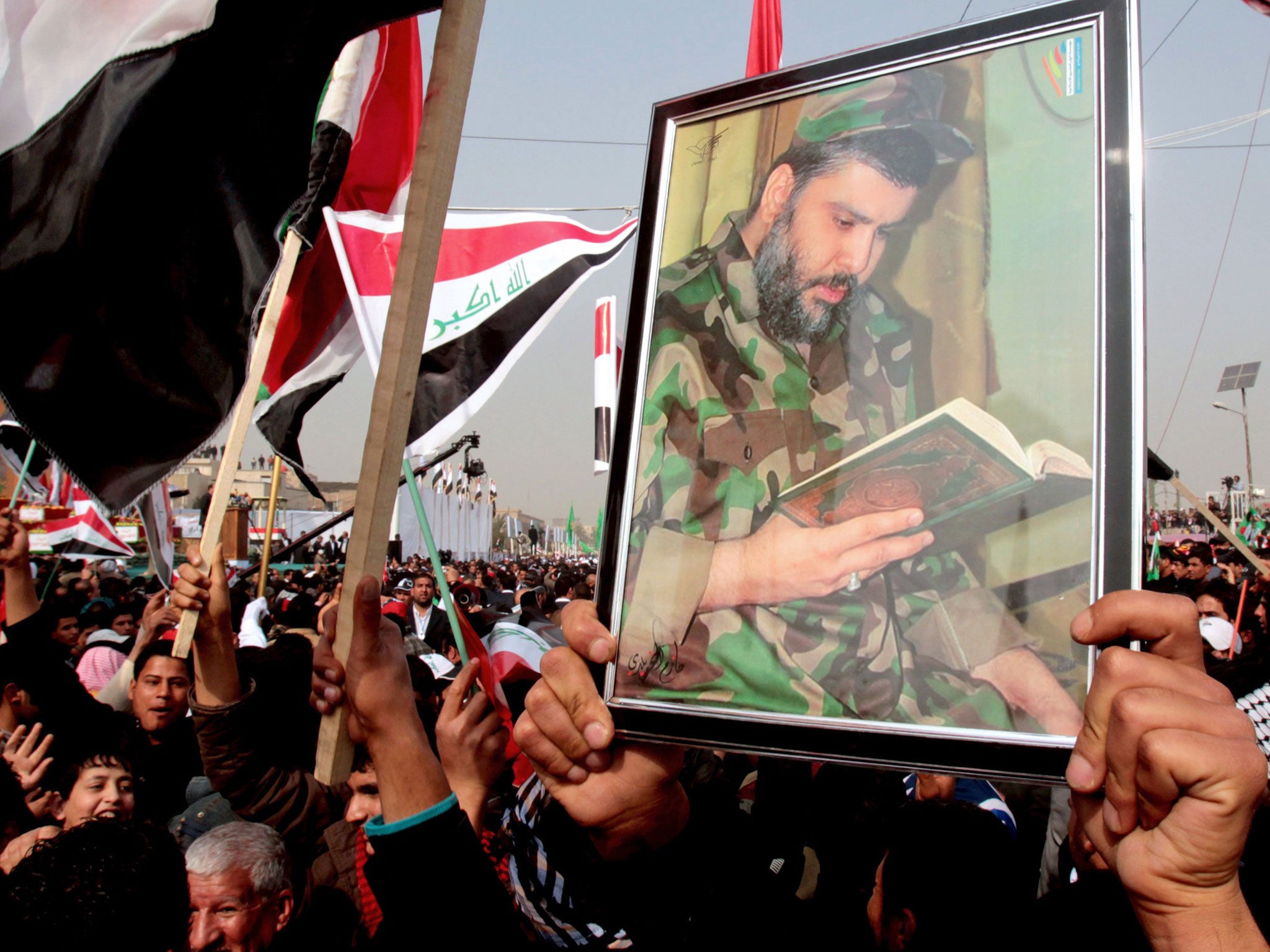 Supporters of Muqtada al-Sadr celebrate the departure of US troops from Sadr City last year