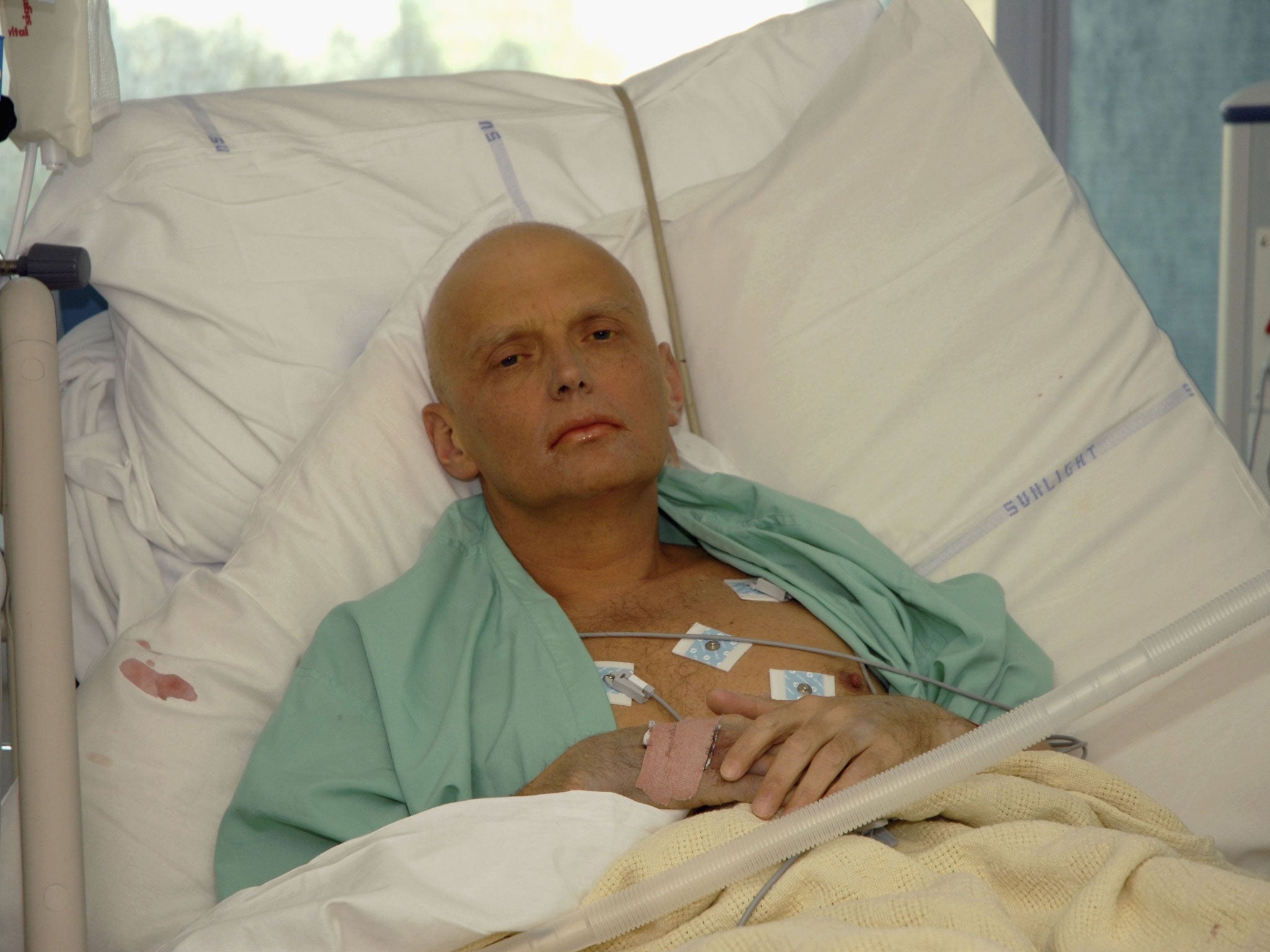 Alexander Litvinenko is pictured at the Intensive Care Unit of University College Hospital in 2006 - secret services allegedly asked the late spy to provide 'expert analysis' on a confidential Foreign Office report