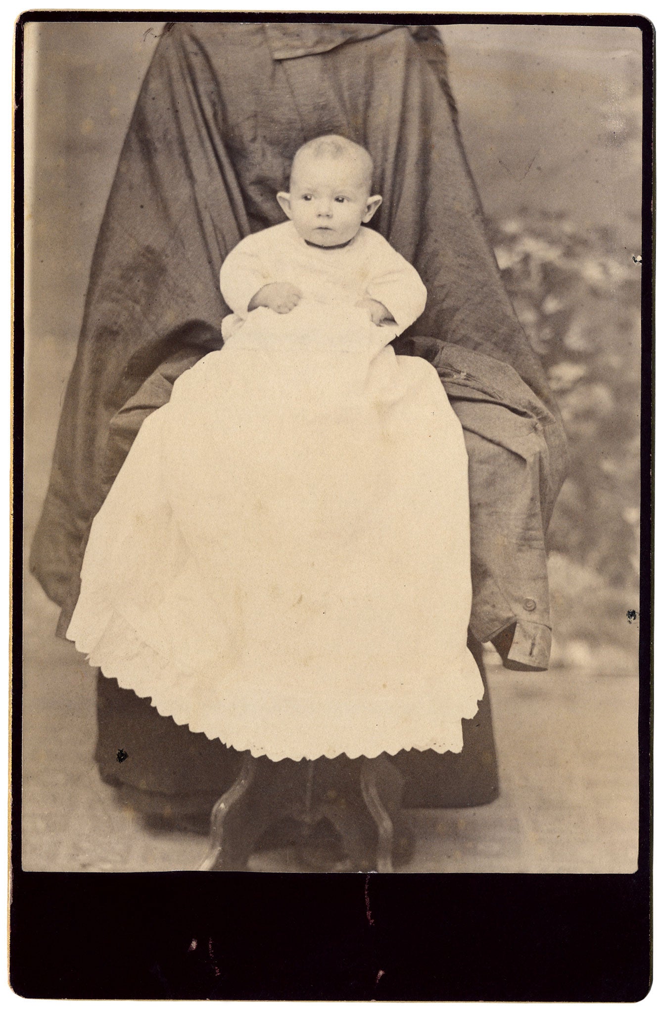 'Hidden mothers': The blacked-out beings hover behind their charges