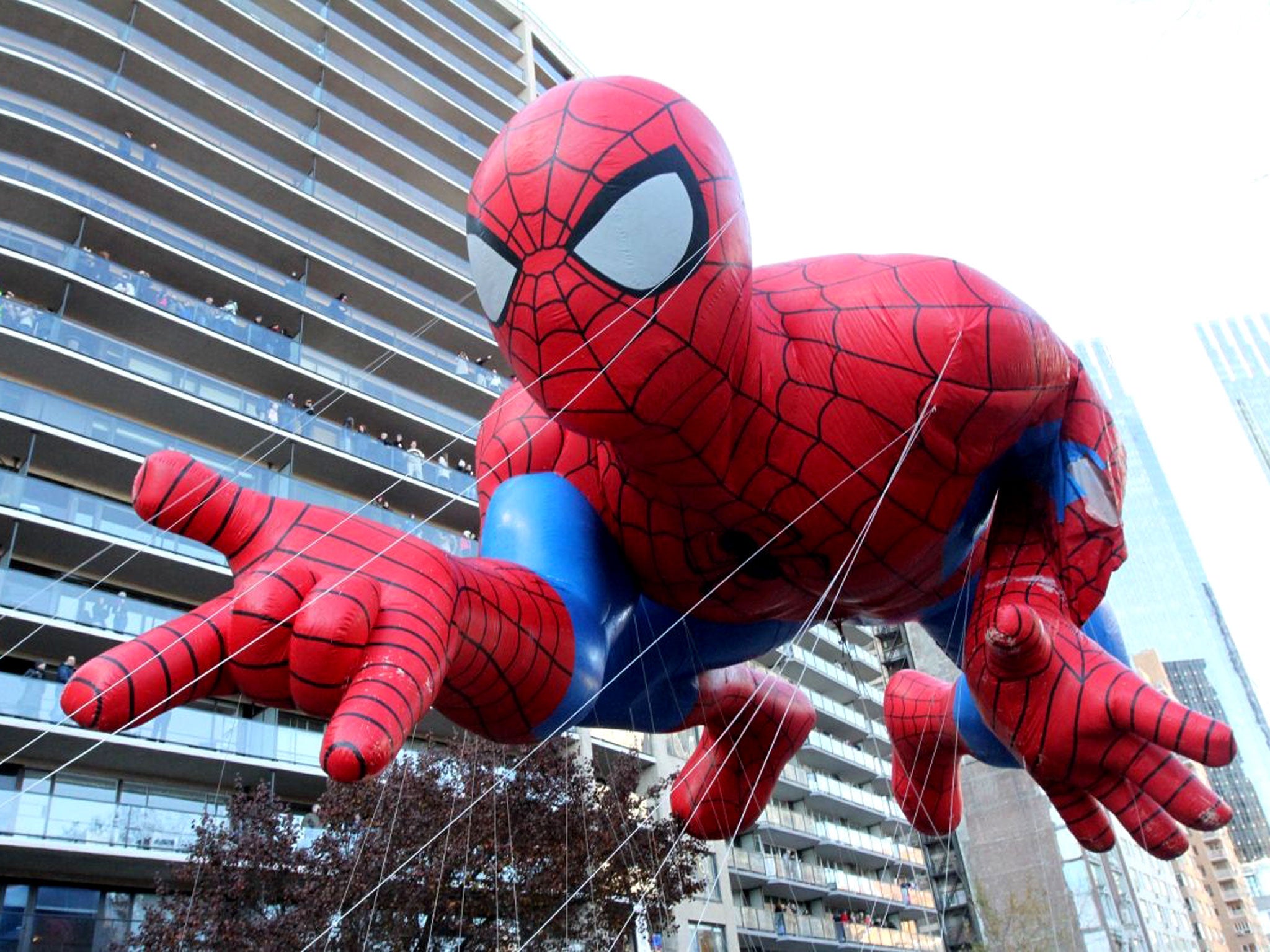 The Spiderman balloon makes it way across New York's Central Park South during the Macy's Thanksgiving Day Parade