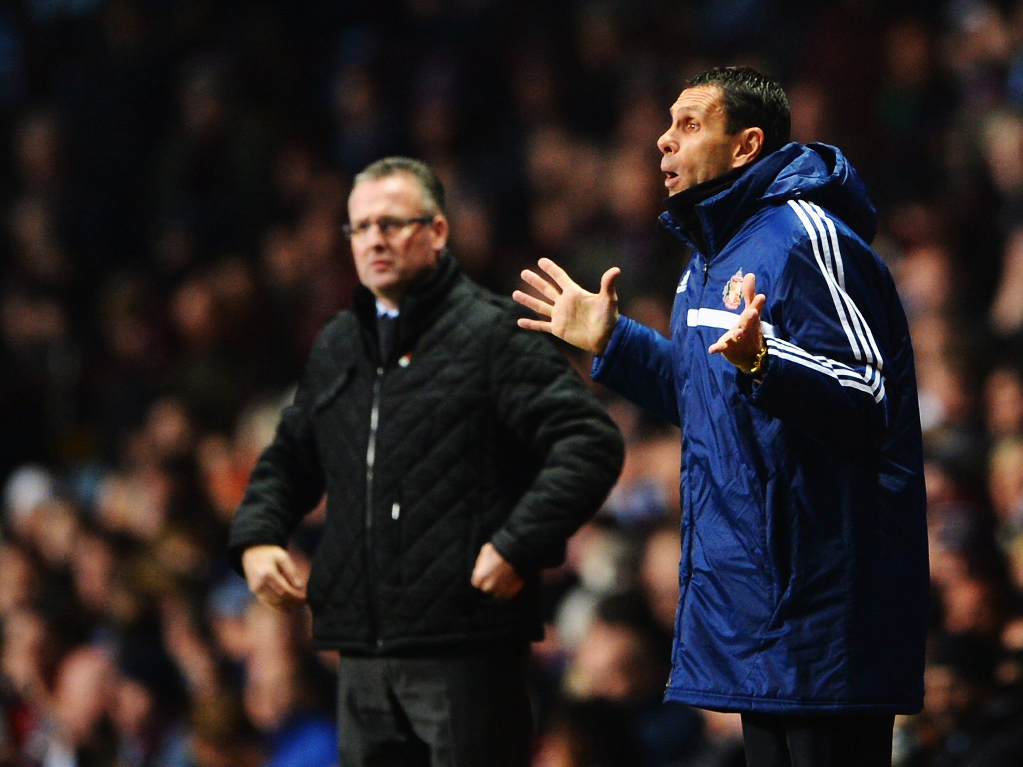 Paul Lambert and Gus Poyet look on during the Aston Villa v Sunderland Premier League encounter