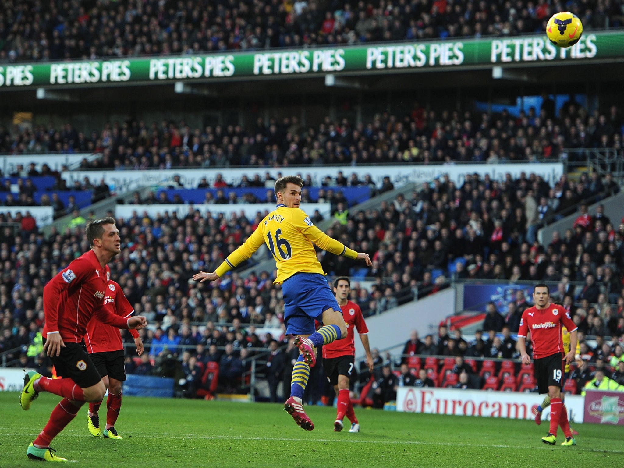 Aaron Ramsey puts Arsenal ahead with a header against Cardiff