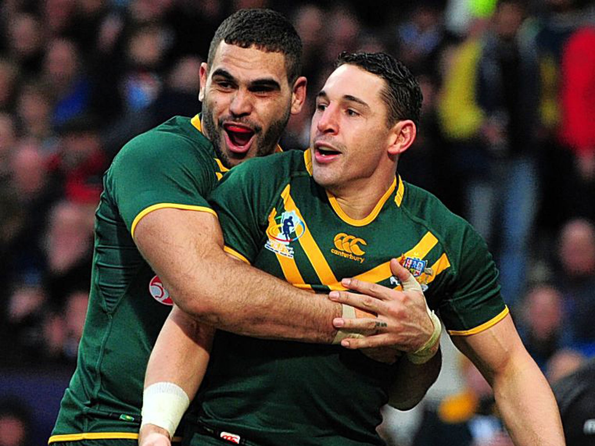 Get a grip: Try scorer Billy Slater (right) gets a big hug from Greg Inglis as Australia beat New Zealand 34-2 in yesterday’s World Cup final