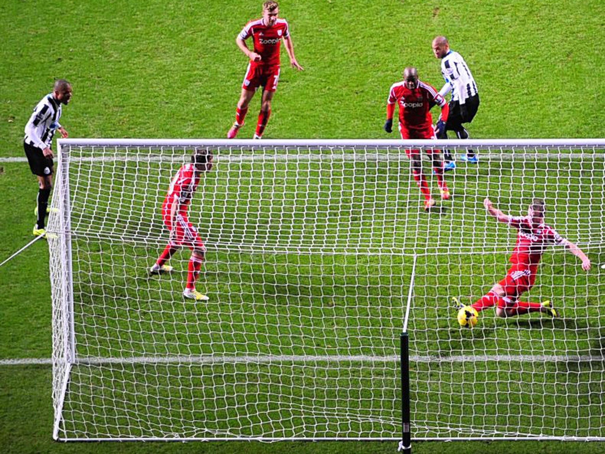 Opening strike: Yoan Gouffran, centre, scores to set Newcastle on their way